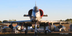 A-4E Skyhawk attack aircraft on the field at the Pacific Coast Air Museum. View is from directly in front. Pylons are filled with inert ordnance.