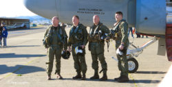 The four-man aircrew of EA-6B Prowler #158811 standing by the nose of the plane after its final flight.