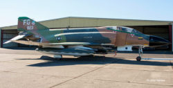 F-4C Phantom II being towed across a concrete ramp. Broadside view of the right side.