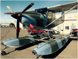 Float-equipped SIAI-Marchetti SM-1019 on the ramp at an airport